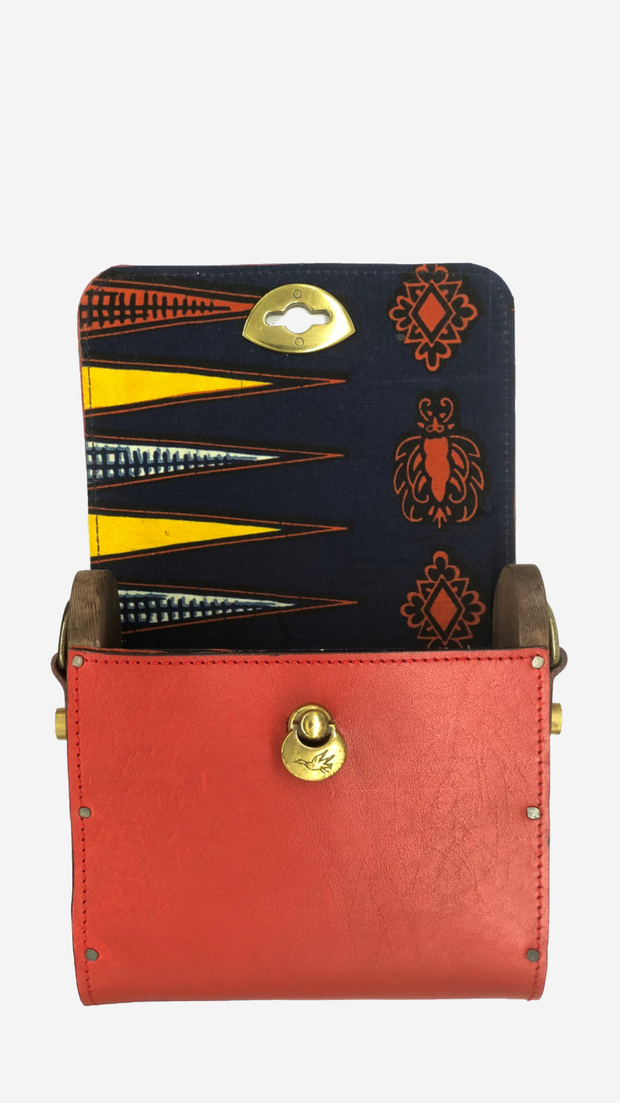red backpack, Satchel, Clutch,Fanny pack, Cross-body bag) easy changing position, Inspired by Spanish and African Culture SPECS Outer: 100% Spanish Cattle leather Lining: 100% Wax African Print fabric Sides: 100% Pine Wood hand Painted One compartment Vintage Click-plated 