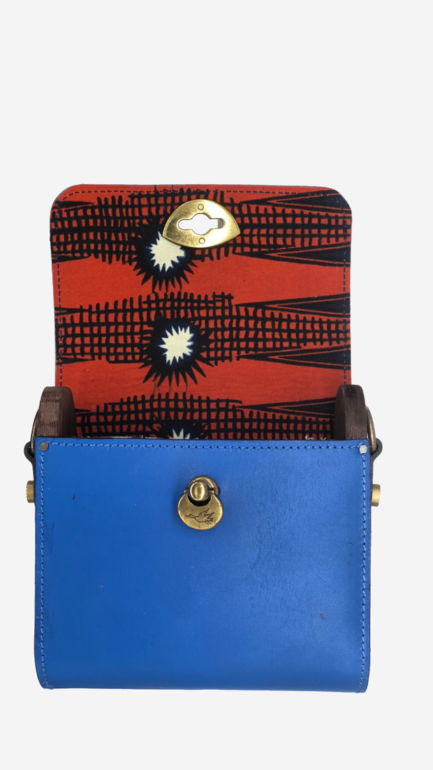blue backpack, Satchel, Clutch,Fanny pack, Cross-body bag) easy changing position, Inspired by Spanish and African Culture SPECS Outer: 100% Spanish Cattle leather Lining: 100% Wax African Print fabric Sides: 100% Pine Wood hand Painted One compartment Vintage Click-plated 