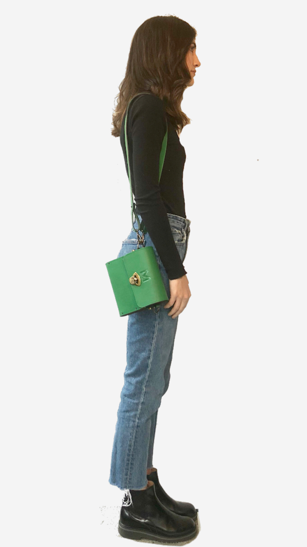 green backpack, Satchel, Clutch,Fanny pack, Cross-body bag) easy changing position, Inspired by Spanish and African Culture SPECS Outer: 100% Spanish Cattle leather Lining: 100% Wax African Print fabric Sides: 100% Pine Wood hand Painted One compartment Vintage Click-plated 